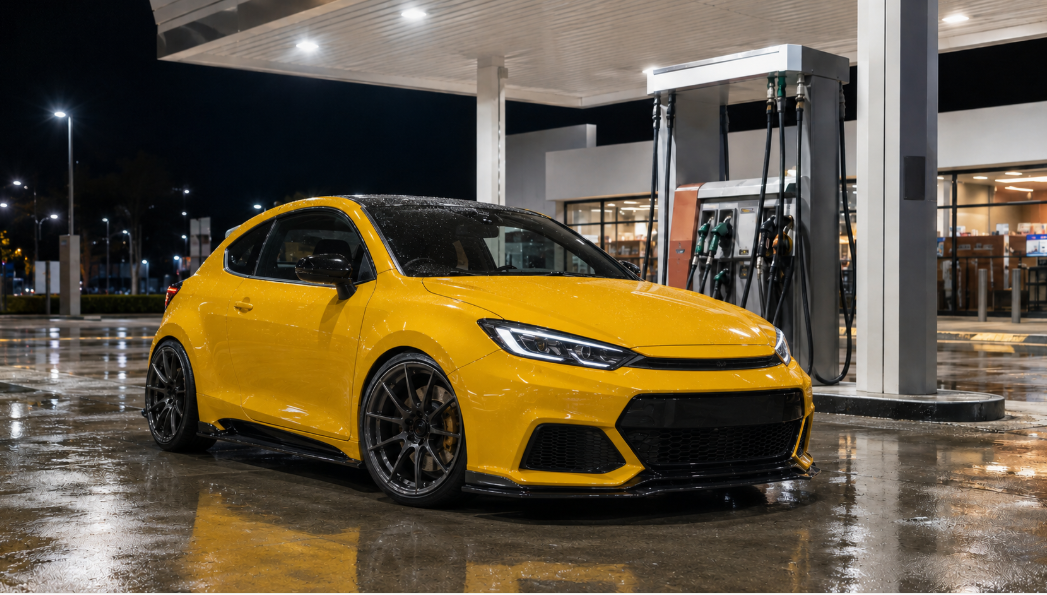 Stylish compact car at a fuel station